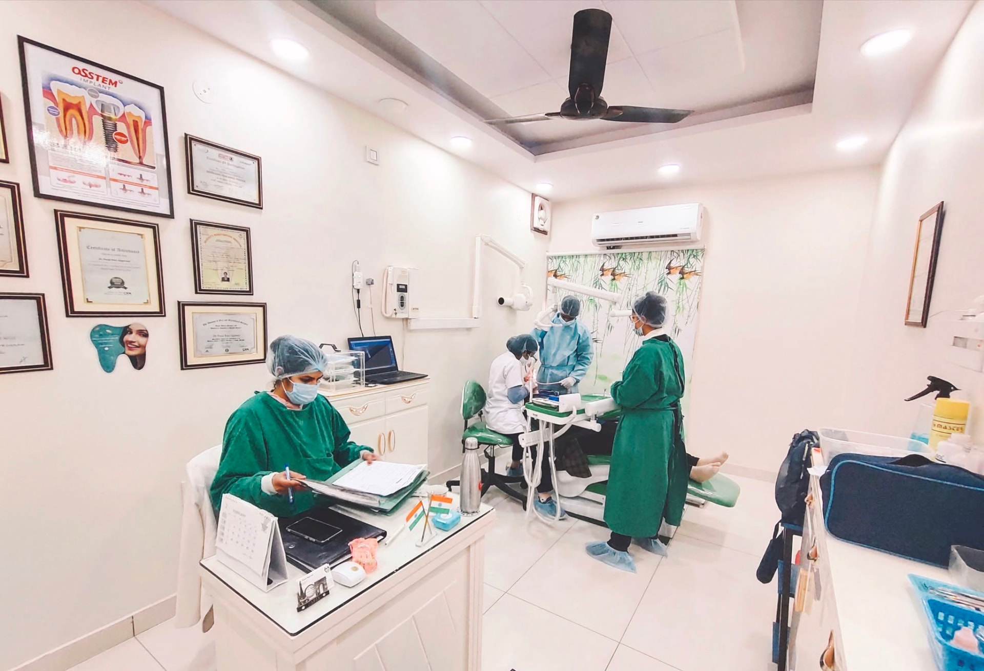 Inside a partner dental clinic with treatment chairs, digital imaging and framed credentials